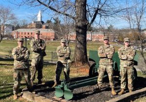 group of 5 army cadets standing outside