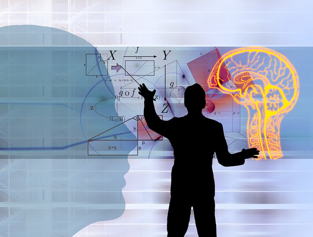 Image of a face silhouette watching a schematic of a man interfacing with mathematical symbols and a human brain