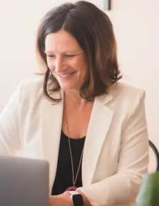 photo of Dr. Marna Winter working at a computer